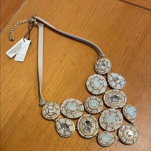 Silver and Cream Bib Necklace with Circular Elements